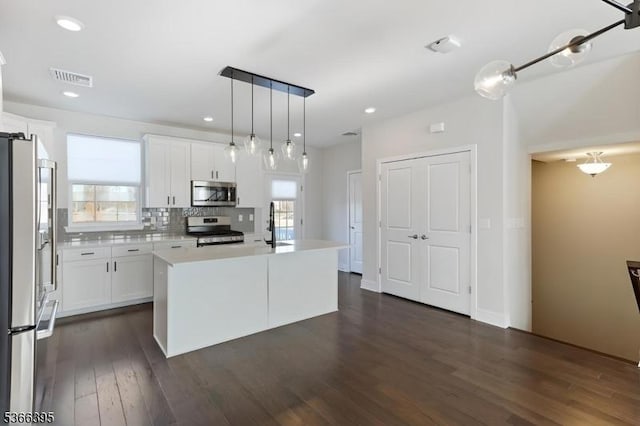 26 Gerhard, Morris Twp, NJ 07960 - kitchen featuring appliances with stainless steel finishes, light countertops, white cabinetry, dark wood finished floors, and recessed lighting