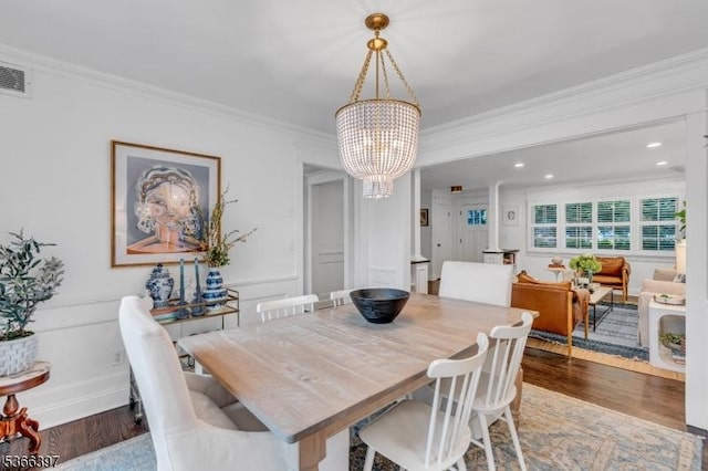 913 Columbus Ave, Westfield Town, NJ 07090 - dining area with crown molding, a chandelier, wood finished floors, and recessed lighting