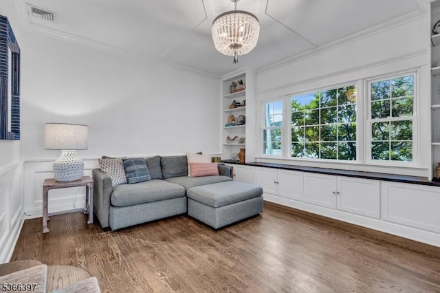 913 Columbus Ave, Westfield Town, NJ 07090 - living area featuring crown molding, a chandelier, wood finished floors, and built in features