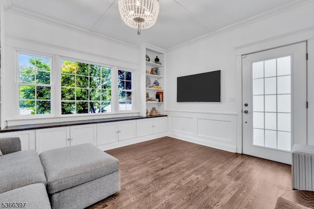 913 Columbus Ave, Westfield Town, NJ 07090 - living area featuring healthy amount of natural light, wood finished floors, ornamental molding, a chandelier, and a wainscoted wall