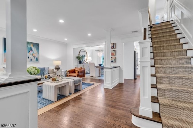 913 Columbus Ave, Westfield Town, NJ 07090 - living area featuring wood finished floors, ornamental molding, recessed lighting, stairway, and ornate columns