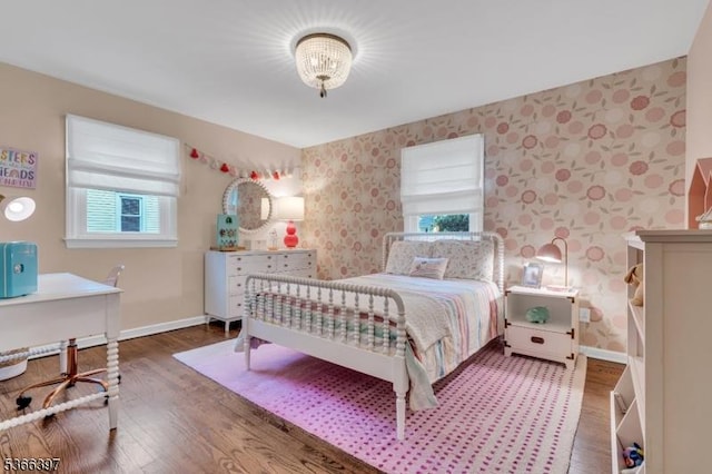 913 Columbus Ave, Westfield Town, NJ 07090 - bedroom featuring wallpapered walls, multiple windows, wood finished floors, and an office area