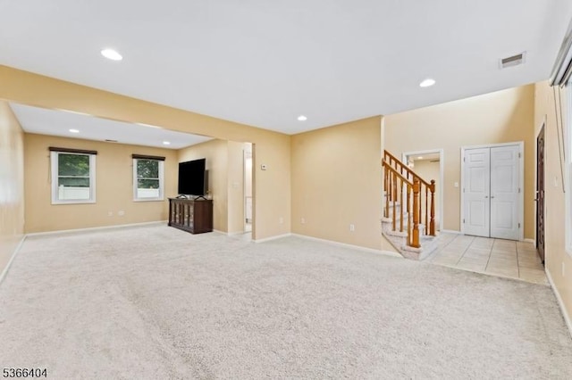 88 San Antonio Ave, Nutley Twp, NJ 07110 - unfurnished living room with stairway, light colored carpet, and recessed lighting
