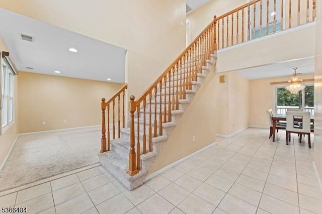 88 San Antonio Ave, Nutley Twp, NJ 07110 - stairs with tile patterned flooring, a chandelier, carpet, recessed lighting, and a high ceiling