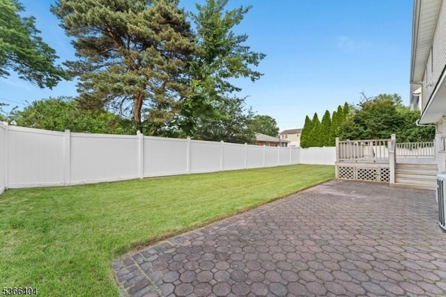 88 San Antonio Ave, Nutley Twp, NJ 07110 - fenced backyard with a patio area and a wooden deck