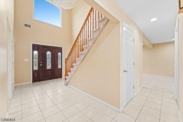 88 San Antonio Ave, Nutley Twp, NJ 07110 - entrance foyer with light tile patterned floors, stairs, a chandelier, a towering ceiling, and recessed lighting