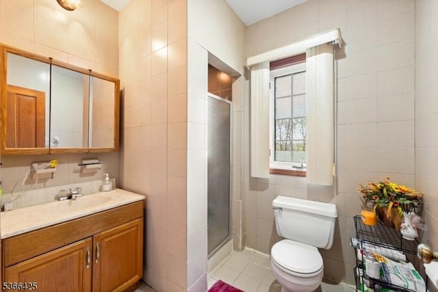 444 Harrison Ave, Lodi Boro, NJ 07644 - bathroom featuring tile walls, vanity, a shower stall, and tile patterned flooring