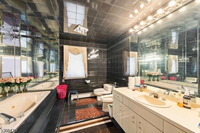 444 Harrison Ave, Lodi Boro, NJ 07644 - full bathroom with a bidet, a tub with jets, vanity, tile walls, and baseboard heating