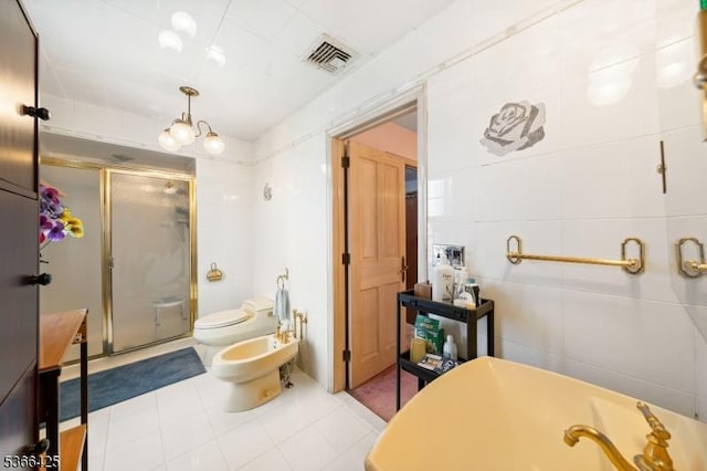 444 Harrison Ave, Lodi Boro, NJ 07644 - full bath with a bidet, a stall shower, a bathtub, tile patterned floors, and tile walls