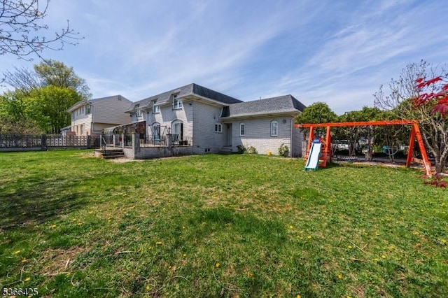 444 Harrison Ave, Lodi Boro, NJ 07644 - rear view of house with a playground and brick siding