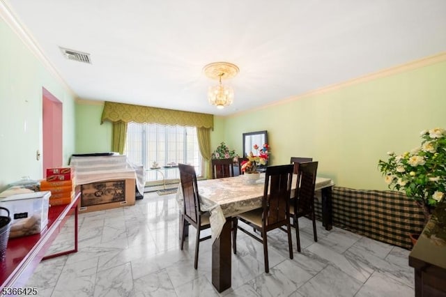 444 Harrison Ave, Lodi Boro, NJ 07644 - dining area with ornamental molding, marble finish flooring, and a chandelier