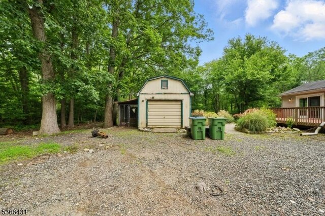 240 Free Union Rd, Liberty Twp, NJ 07838 - view of yard with an outdoor structure, a garage, a wooden deck, and driveway