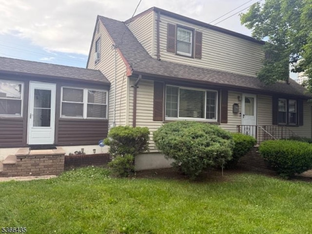 1221 Union St, Linden City, NJ 07036 - view of front facade with a front yard and a shingled roof