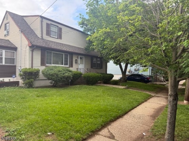1221 Union St, Linden City, NJ 07036 - view of front facade with a front lawn and roof with shingles