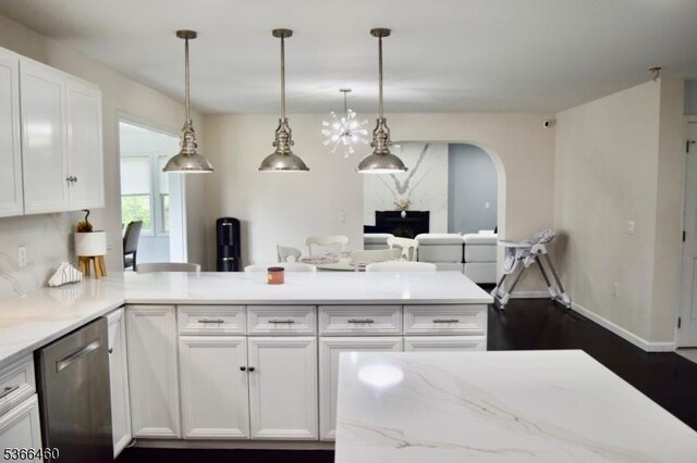 710 County Road 513, Alexandria Twp, NJ 08867 - kitchen featuring stainless steel dishwasher, white cabinetry, a peninsula, arched walkways, and light stone countertops