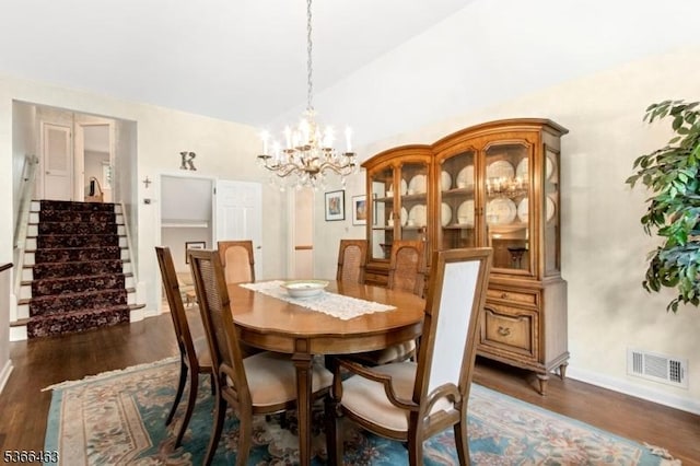 10 Cross Way, New Providence Boro, NJ 07974 - dining space featuring dark wood finished floors, a chandelier, vaulted ceiling, and stairway