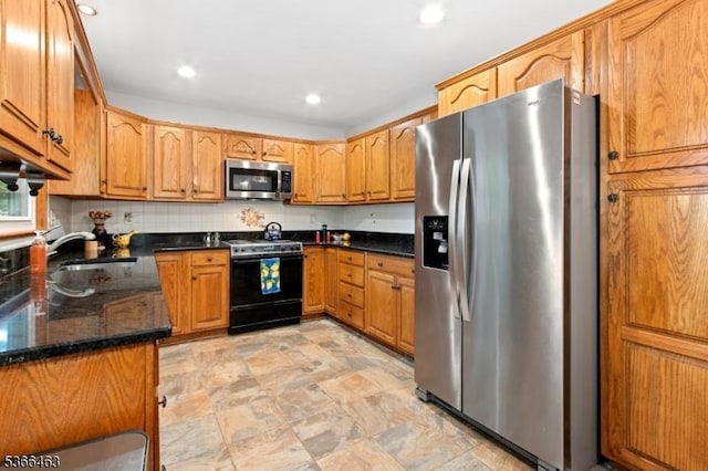 10 Cross Way, New Providence Boro, NJ 07974 - kitchen with appliances with stainless steel finishes, dark stone countertops, brown cabinets, recessed lighting, and tasteful backsplash