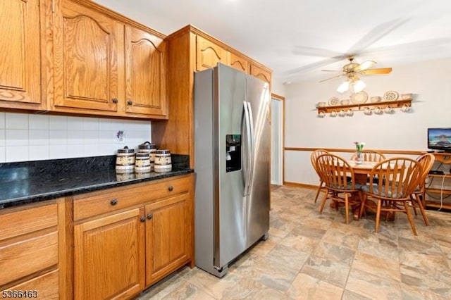 10 Cross Way, New Providence Boro, NJ 07974 - kitchen featuring stainless steel fridge, backsplash, a ceiling fan, brown cabinets, and dark stone countertops