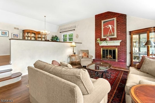 10 Cross Way, New Providence Boro, NJ 07974 - living room with lofted ceiling, wood finished floors, a chandelier, and a brick fireplace