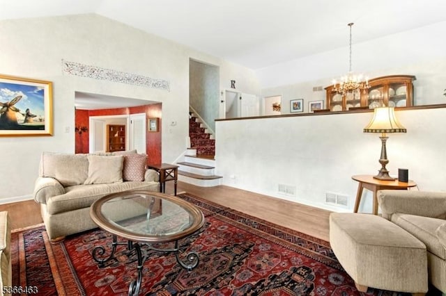10 Cross Way, New Providence Boro, NJ 07974 - living area featuring wood finished floors, a chandelier, stairs, and lofted ceiling