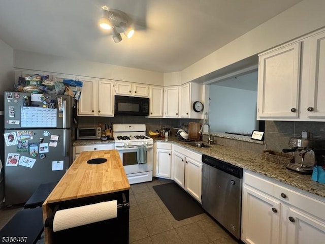 337 Smithwold Rd, Franklin Twp, NJ 08873 - kitchen with stainless steel appliances, butcher block countertops, white cabinets, and backsplash