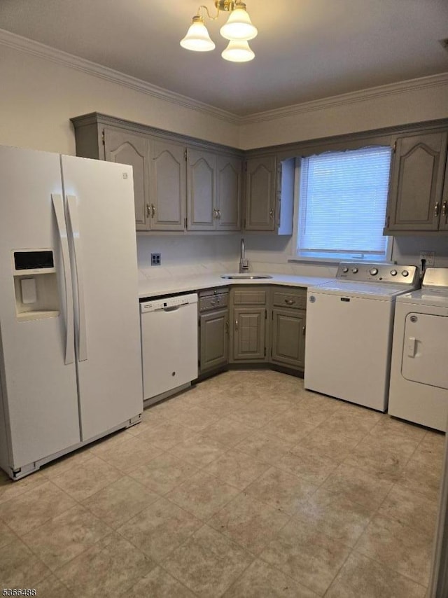 219 Magie Ave, Roselle Park Boro, NJ 07204 - kitchen with white appliances, washer and clothes dryer, gray cabinetry, crown molding, and light countertops