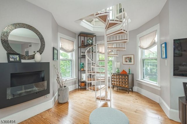 151 N Union St Unit 6, Lambertville City, NJ 08530 - living area with stairway, plenty of natural light, wood finished floors, and a skylight