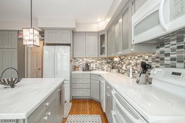 151 N Union St Unit 6, Lambertville City, NJ 08530 - kitchen featuring white appliances, gray cabinetry, light wood-style flooring, and tasteful backsplash