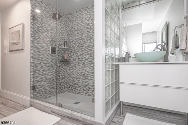 151 N Union St Unit 6, Lambertville City, NJ 08530 - bathroom with vanity, a stall shower, and wood finished floors