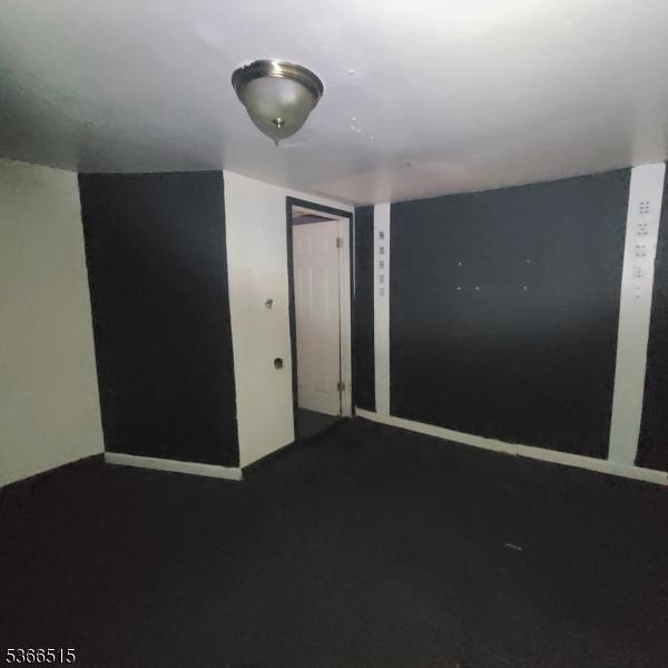 471 S 16th St, Newark City, NJ 07103 - empty room with dark carpet