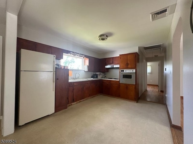 39 Green St, Oxford Twp, NJ 07863 - kitchen with freestanding refrigerator, wall oven, light countertops, and under cabinet range hood