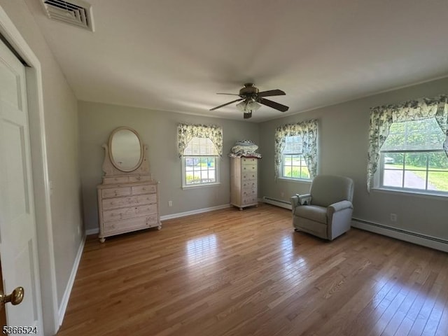 39 Green St, Oxford Twp, NJ 07863 - unfurnished room featuring a baseboard heating unit, wood finished floors, and ceiling fan