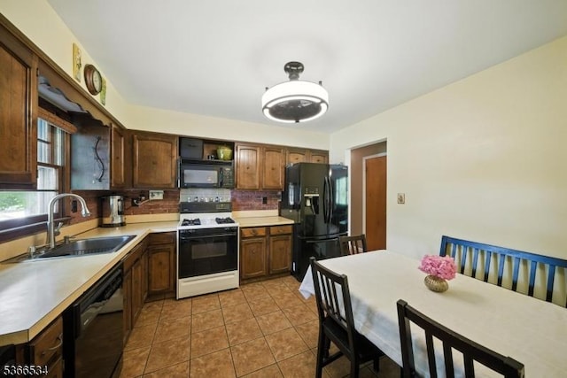 54 Pine Ln, West Milford Twp, NJ 07480 - kitchen featuring black appliances, tasteful backsplash, light countertops, and light tile patterned flooring