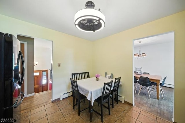 54 Pine Ln, West Milford Twp, NJ 07480 - tiled dining room with baseboard heating and a chandelier
