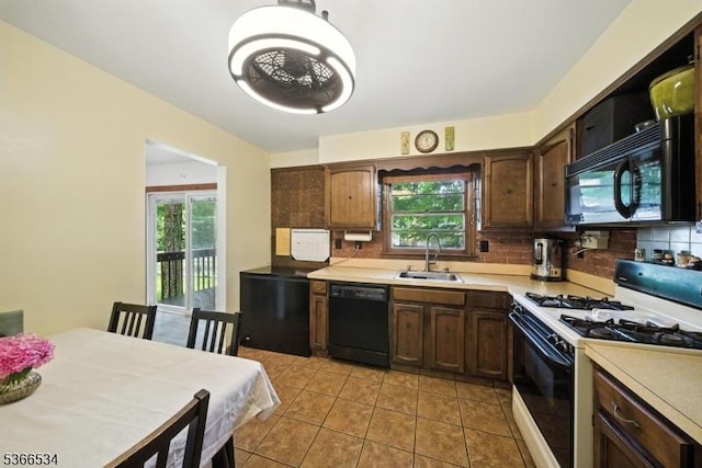 54 Pine Ln, West Milford Twp, NJ 07480 - kitchen with black appliances, decorative backsplash, light countertops, and light tile patterned floors