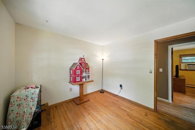 54 Pine Ln, West Milford Twp, NJ 07480 - spare room featuring light wood-style floors, a baseboard heating unit, cooling unit, and a baseboard radiator