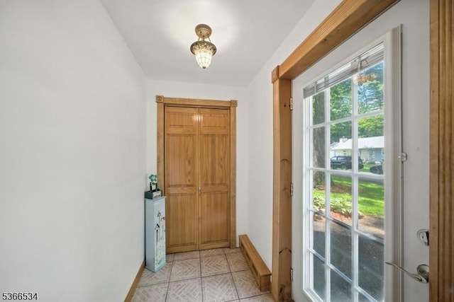 54 Pine Ln, West Milford Twp, NJ 07480 - doorway with baseboards and light tile patterned flooring