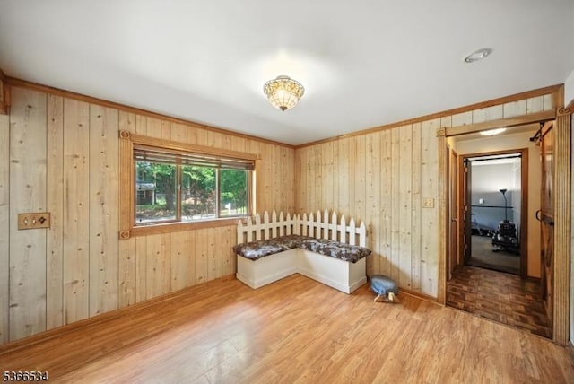 54 Pine Ln, West Milford Twp, NJ 07480 - spare room with wood finished floors, wooden walls, and ornamental molding