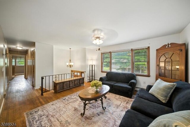 54 Pine Ln, West Milford Twp, NJ 07480 - living room featuring attic access, wood finished floors, and a chandelier