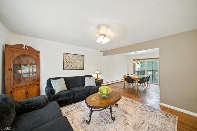 54 Pine Ln, West Milford Twp, NJ 07480 - living room featuring a baseboard heating unit and wood finished floors