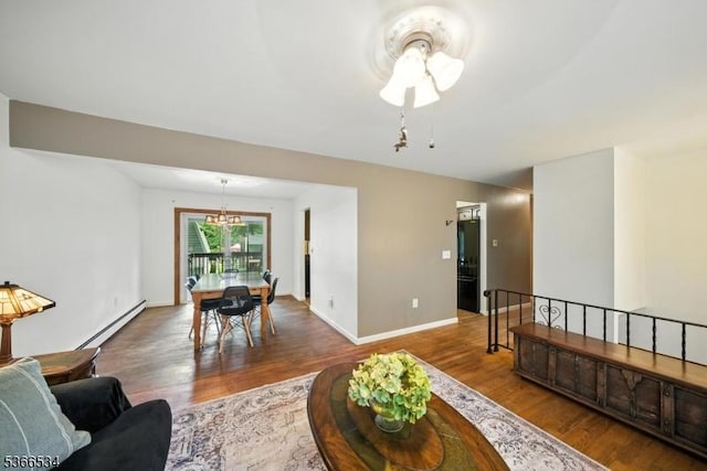 54 Pine Ln, West Milford Twp, NJ 07480 - living room with wood finished floors, a baseboard radiator, and a chandelier