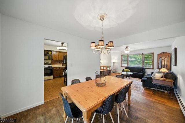 54 Pine Ln, West Milford Twp, NJ 07480 - dining room featuring a baseboard heating unit, a chandelier, and dark wood-type flooring