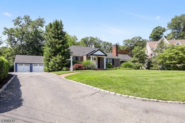 19 Mountain Ridge Dr, Wayne Twp, NJ 07470 - view of front of home with an outbuilding, a chimney, a front lawn, and a detached garage