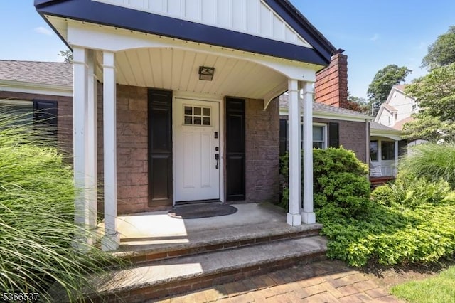19 Mountain Ridge Dr, Wayne Twp, NJ 07470 - view of exterior entry featuring board and batten siding and roof with shingles