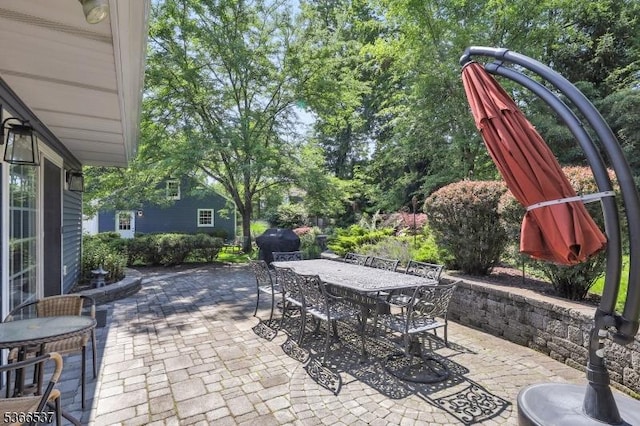 19 Mountain Ridge Dr, Wayne Twp, NJ 07470 - view of patio featuring outdoor dining area and view of wooded area