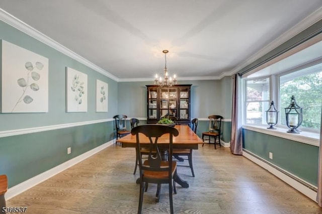 19 Mountain Ridge Dr, Wayne Twp, NJ 07470 - dining area with a baseboard heating unit, crown molding, a chandelier, and wood finished floors