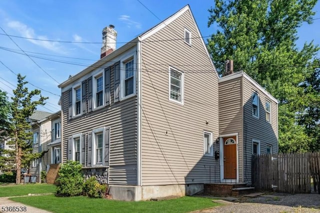853 Westfield Ave, Rahway City, NJ 07065 - view of side of home with entry steps and a chimney
