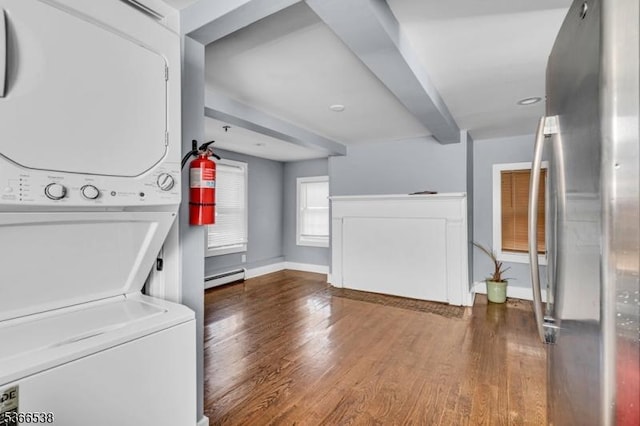 853 Westfield Ave, Rahway City, NJ 07065 - laundry area with stacked washer / dryer, a baseboard radiator, and wood finished floors