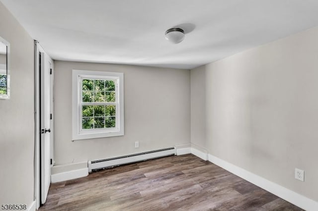 853 Westfield Ave, Rahway City, NJ 07065 - unfurnished room with a baseboard heating unit and wood finished floors