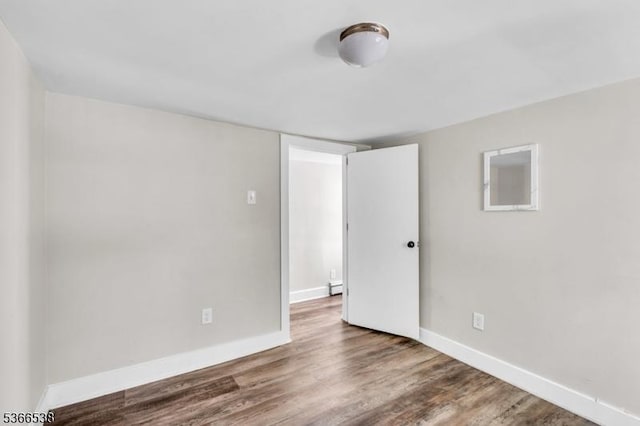 853 Westfield Ave, Rahway City, NJ 07065 - spare room with wood finished floors and baseboard heating